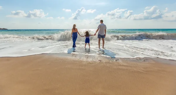 family caravaning on a beach