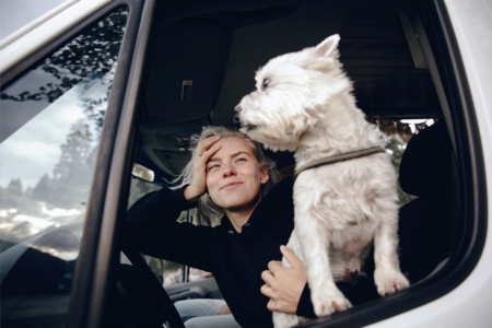 woman-dog-car-pexels-pnw-production